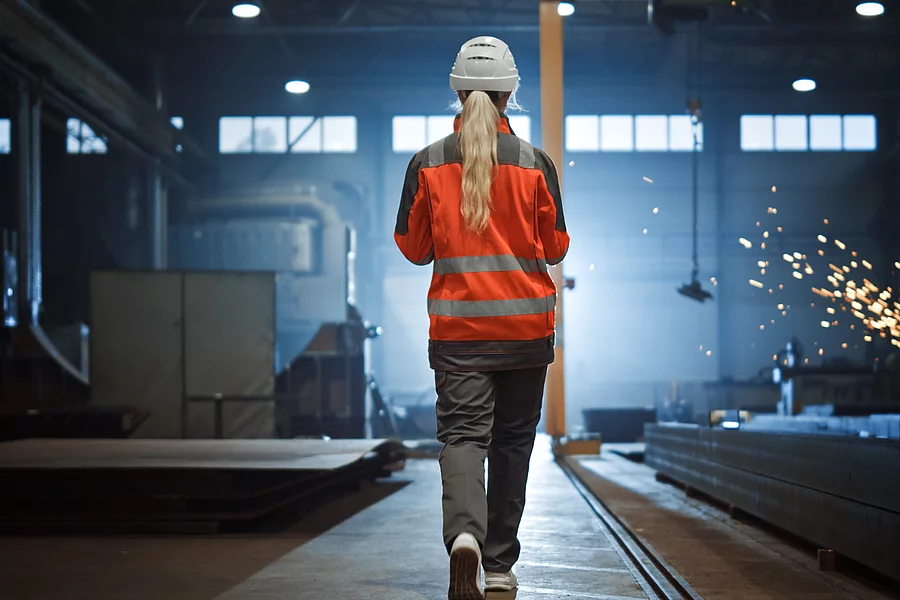 Professional Heavy Industry Engineer - Worker Wearing Safety Uniform and Hard Hat Uses Tablet Computer.